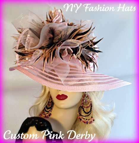 Ladies Soft Pink Designer Sheer Wide Brim Fashion Haute Couture Kentucky Derby Horse Racing Hat Embellished With Pink And Brown Striped Tiger Type Feathers. A Large Pink Horse Bow And A Pink Organza Bow With Pink Satin Edging Is Mixed Into The Feather Mix. This Romantic Styled Avant Garde Hat, Will Make Any Women Feel Feminine. This Dress Hat Is Suited For A Bride To Be On Her Wedding Day, Or For Wedding Guests. This Dress Hat Is Suited Also For Church, Weddings, Formals, Holidays And Special Occasions.
