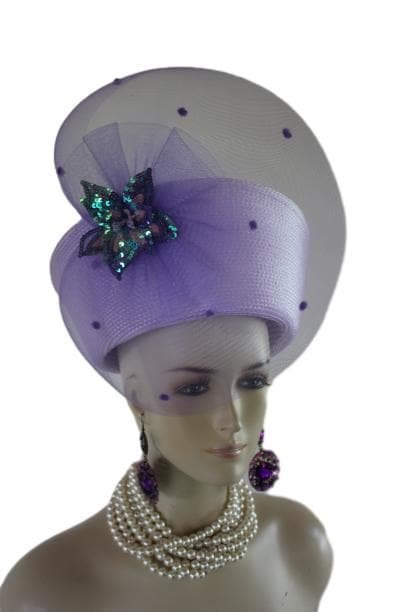Lavender Soft Purple Haute Couture High Crown Nefertiti Style Women's Pillbox Hat Headdress, Formal Wedding Dress Mother Of The Bride Hat. This Glamorous Avant Garde Hat Is Made And Designed By NY Fashion Hats Millinery For Women. This Beautiful Hat Is Adorned With A Large Lavender Purple Horsehair Crinoline Bow. Placed In The Center Of This Elegant Bow Is Handmade Soft Lavender Purple And Pink Sequin Vintage Millinery Flower.