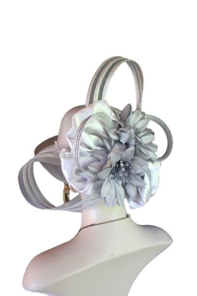 Haute Couture Designer Avant Garde Shaped Sculptured High Fashion Hat For Women. This Formal Wedding Hat Is Embellished With A Large Gray Satin Hand Made Bow Enhanced With A Combination Of Gray Poly Straw Sculptured Loop Bowing. Placed With This Beautiful Bow Is Are Large Handmade Vintage Gray Satin Flowers Embedded With Vintage Silk Millinery Flower Centers. A Beautiful Embroidered Sequin Trim Encircles The Lower Crown Of This Beautiful Headpiece Cocktail Hat. This Avant Garde Hat Is A Fashion Statement Piece.This Formal Hat Can Be Worn In Different Positions. The Bowing Can Be Worn Toward The Face Or Toward The Back Of The Head.