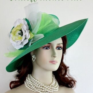 Ladies Kelly Green Wide Brim Formal Haute Couture Fashion Kentucky Derby Hat With Expensive Silk Millinery Flowers. This Custom Made Women's Designer Hat Is Embellished With A Large Kelly Green Crinoline Horsehair Bow, Mixed With A Lime Green Organza Bow. Beautiful Silk Handmade White, Lime And Kelly Green Flowers Are Placed In The Center Of This Bow. A Hand Dyed Beaded Lime Green Velvet Trim Encircles The Crown Of This Fashion Hat. This Gorgeous Designer Hat Is Suited For A Bride To Be On Her Wedding Day, Horse Races, The Kentucky Derby, Breeder's Cup, Maryland Million Day, Iroquois Steeplechase Horse Races, The Melbourne Cup, The Royal Ascot, Church, Weddings, Formals, And Special Occasion. This Fashion Hat Is Custom Made By Women's Hats, hatswomens.com.